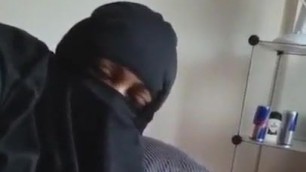 Niqab giving handjob to husband