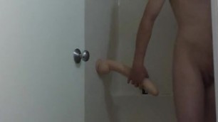 Guy fucks huge dildo in the shower
