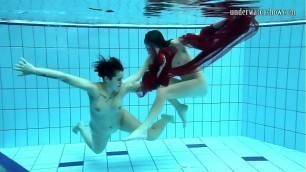 Two underwater girls loving eachother